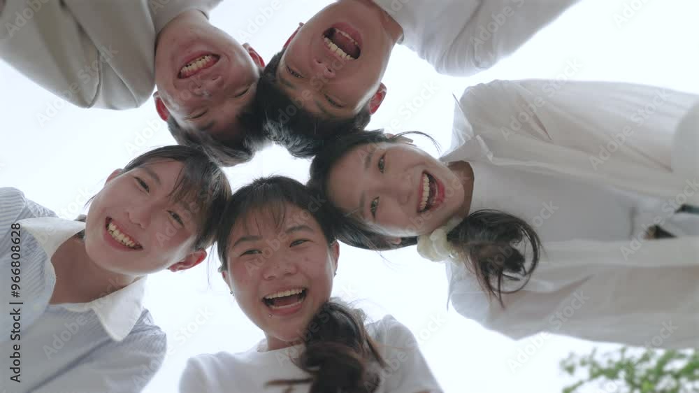 young beautiful people standing in circle and smiling excited at camera. young beautiful people standing in circle and smiling excited at camera.