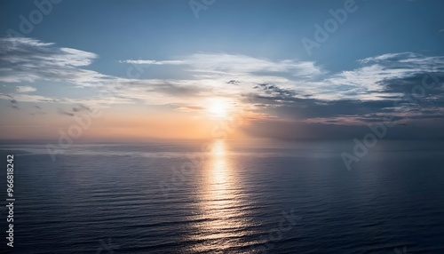 new beginning concept Beautiful orange sunset over the ocean. Reflected on the calm waters with a few clouds in the sky.