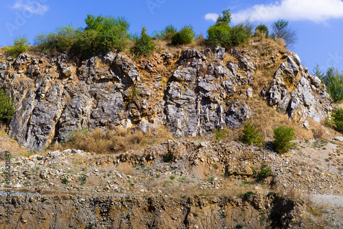 An old, currently unused quarry. A place where limestone was mined. Ostrov u Macochy village, South Moravia, Czech Republic. photo