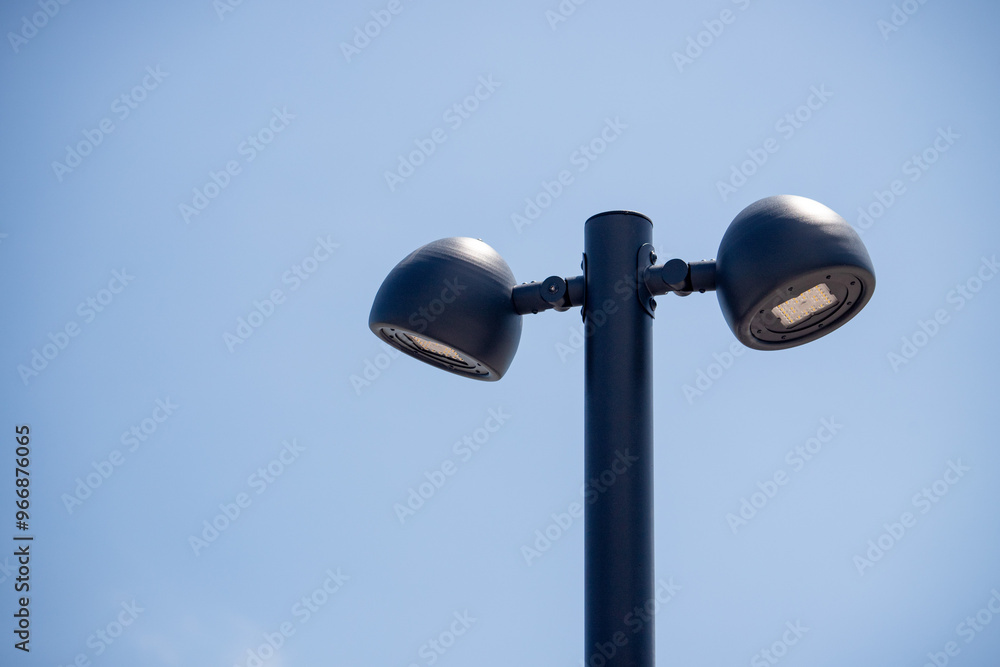 A street light with two lights on top of it A street light with two lights on top of it