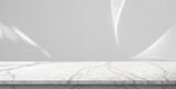 Marble table top with abstract shadow drop on white wall background for mockup product display