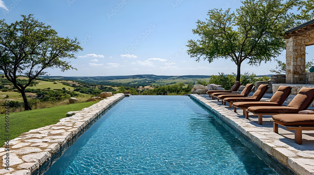 Obraz premium A serene infinity pool overlooking rolling hills and blue skies.