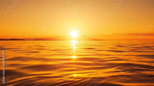 Golden sunset over calm ocean water