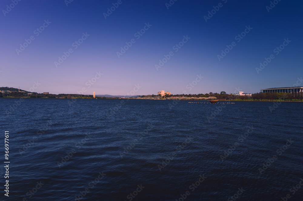 Fototapeta premium The photo showcases the beautiful scenery on both sides of the Lake Burley Griffin