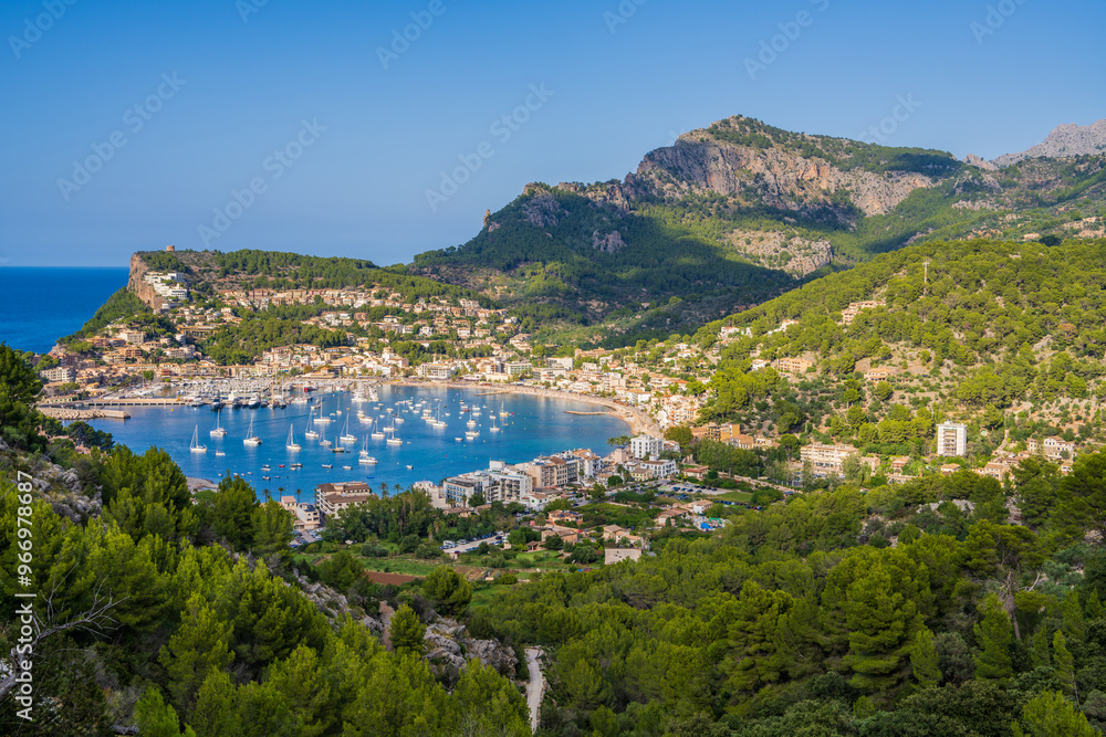 Beautiful harbor of Port de Soller. Stunning location where Tramuntana mountains meet calm turquoise waters of Mallorcas west coast Beautiful harbor of Port de Soller. Stunning location where Tramuntana mountains meet calm turquoise waters of Mallorcas west coast