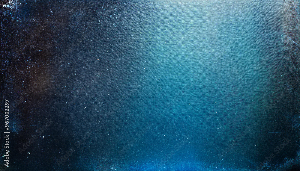 Dusty scratched and scanned old film texture with spots of blue light; creative vintage background; copy space Dusty scratched and scanned old film texture with spots of blue light; creative vintage background; copy space