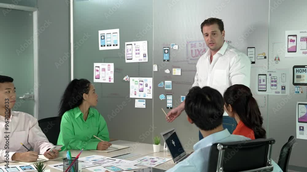 Group of professional business people discuss about using Ux and Ui design. Cooperative diverse business team brainstorming about marketing plan. Business people working together. Manipulator. Group of professional business people discuss about using Ux and Ui design. Cooperative diverse business team brainstorming about marketing plan. Business people working together. Manipulator.