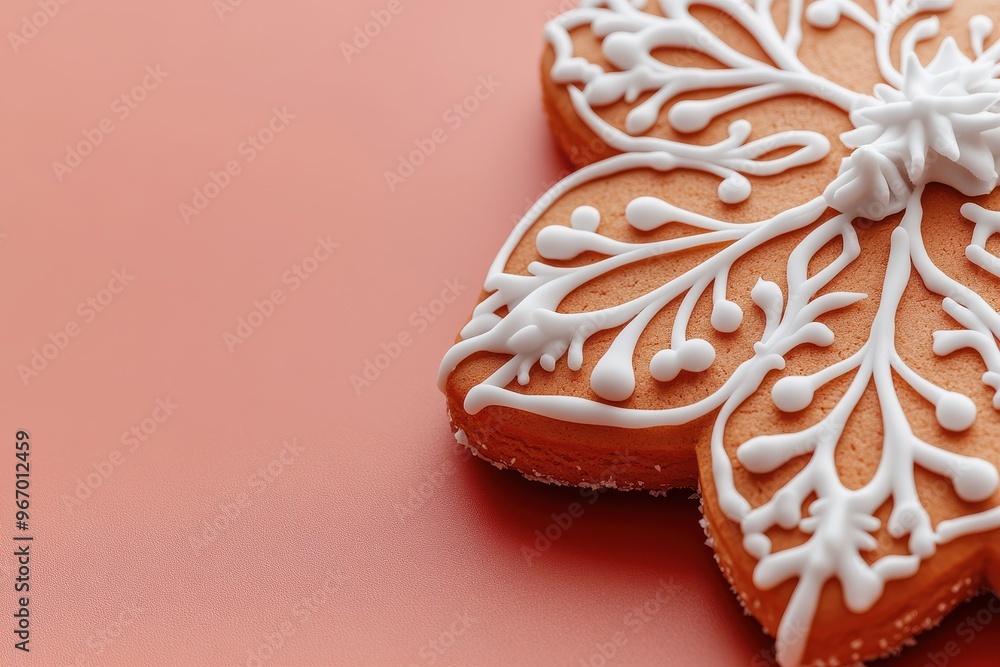 A close up of a gingerbread snowflake with white icing A close up of a gingerbread snowflake with white icing