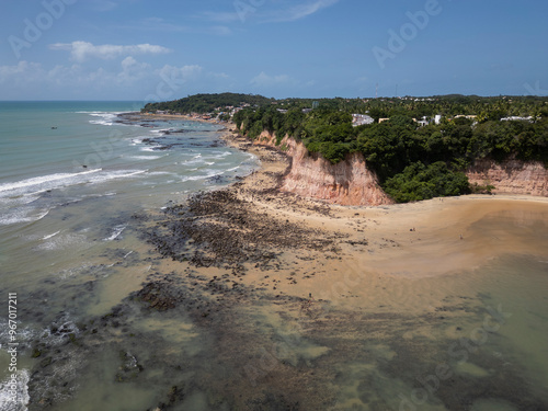 Beautiful aerial view to wild beach and ocean rocks in Pipa photo