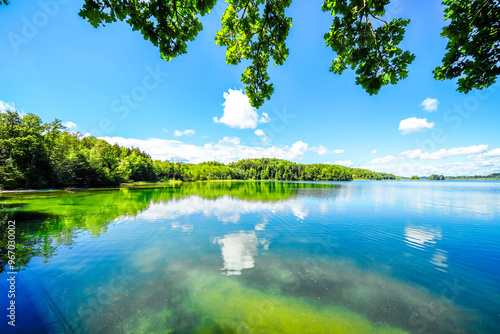 View of Seehamer See and the surrounding landscape in the municipality of Weyarn near Munich. Idyllic nature by the lake with turquoise water.
 photo