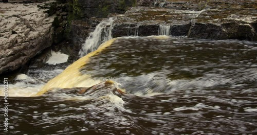 side shot of the river ure going over the lower falls at Aysgarth falls on the river ure, Yorkshire dales photo