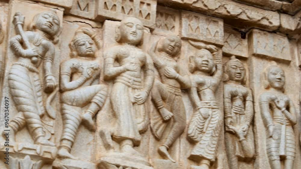 Sculptures of musicians and dancers on hindu holy temple wall at golden hour video is taken at Jagdish Temple udaipur rajasthan india. Sculptures of musicians and dancers on hindu holy temple wall at golden hour video is taken at Jagdish Temple udaipur rajasthan india.