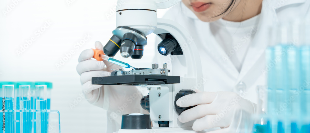 Scientist analyze biochemical samples in advanced scientific laboratory. Medical professional use microscope look microbiological developmental of viral. Biotechnology research in science lab. Scientist analyze biochemical samples in advanced scientific laboratory. Medical professional use microscope look microbiological developmental of viral. Biotechnology research in science lab.