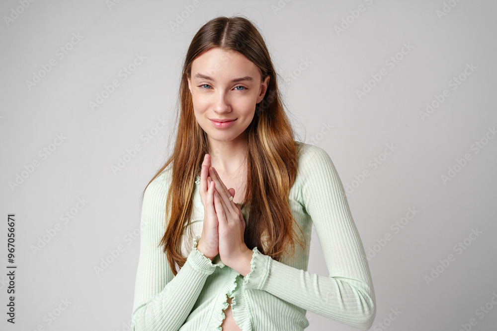 Young Woman With Long Brown Hair With Clasped Hands Young Woman With Long Brown Hair With Clasped Hands