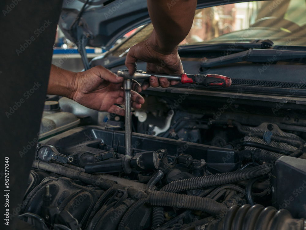 Close up Man hands fixing Car machinery vehicle mechanical service. Mechanic man hands repairing car auto repair shop. open vehicle hood checking up auto mobile. Vehicle Car maintenance engineer. Close up Man hands fixing Car machinery vehicle mechanical service. Mechanic man hands repairing car auto repair shop. open vehicle hood checking up auto mobile. Vehicle Car maintenance engineer.