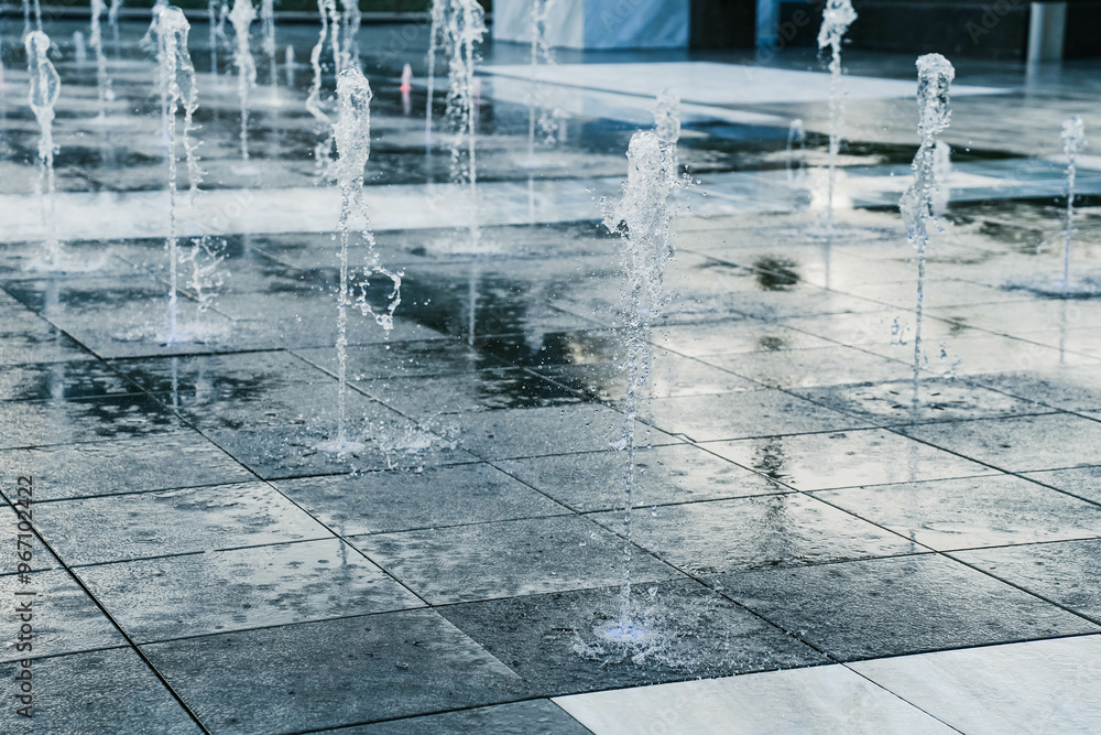A tall fountain that shoots down from the ground