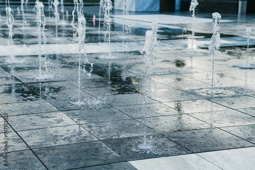 A tall fountain that shoots down from the ground