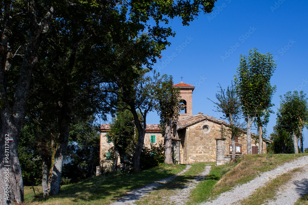 Tuscan-Emilian Apennine church, historic stone architecture in countryside Tuscan-Emilian Apennine church, historic stone architecture in countryside