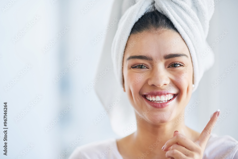 Beauty, lotion and portrait of excited woman in bathroom of home for morning skincare routine. Cream, finger and smile with happy person in towel at apartment for antiaging cosmetics or dermatology Beauty, lotion and portrait of excited woman in bathroom of home for morning skincare routine. Cream, finger and smile with happy person in towel at apartment for antiaging cosmetics or dermatology