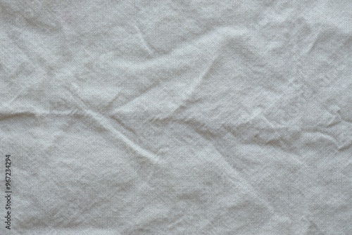 Wallpaper Mural Grey textile napkin in white color as background. Folded decorative kitchen cotton towel Torontodigital.ca