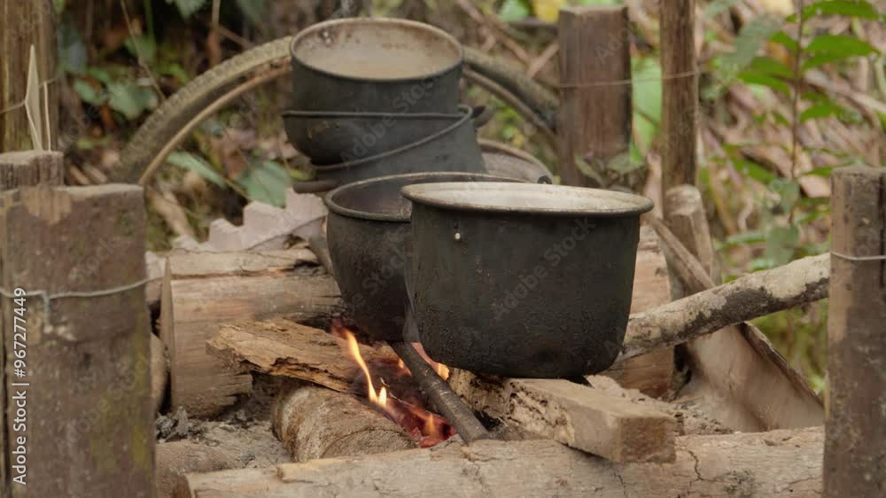 Close-up of cooking on a wood-burning stove in rural setting Close-up of cooking on a wood-burning stove in rural setting
