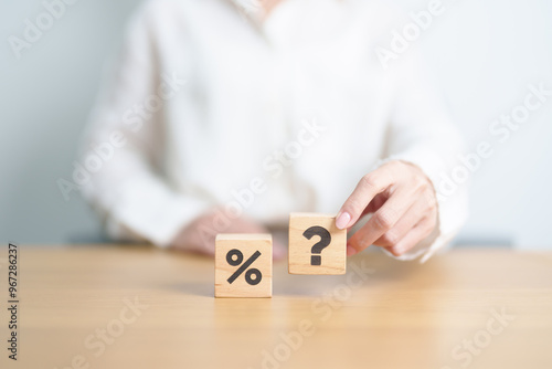 wood block of Question mark and Percentage. Interest rate, GDP, stocks market, financial, deflation and Inflation, ranking, mortgage, debt, Loan and Economic Recession