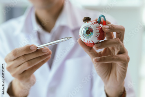 An elderly Asian woman visits an ophthalmologist at a clinic for an eye exam, addressing conditions like cataracts, glaucoma, and presbyopia, with advanced diagnostic tools for vision health. photo