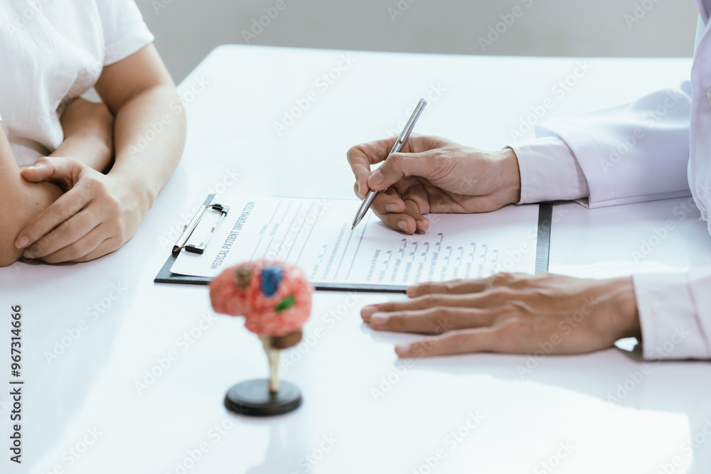 Asian male doctor consults with patient in clinic, reviews medical documents and uses stethoscope to diagnose health conditions, and confidently provides professional advice and care. Asian male doctor consults with patient in clinic, reviews medical documents and uses stethoscope to diagnose health conditions, and confidently provides professional advice and care.