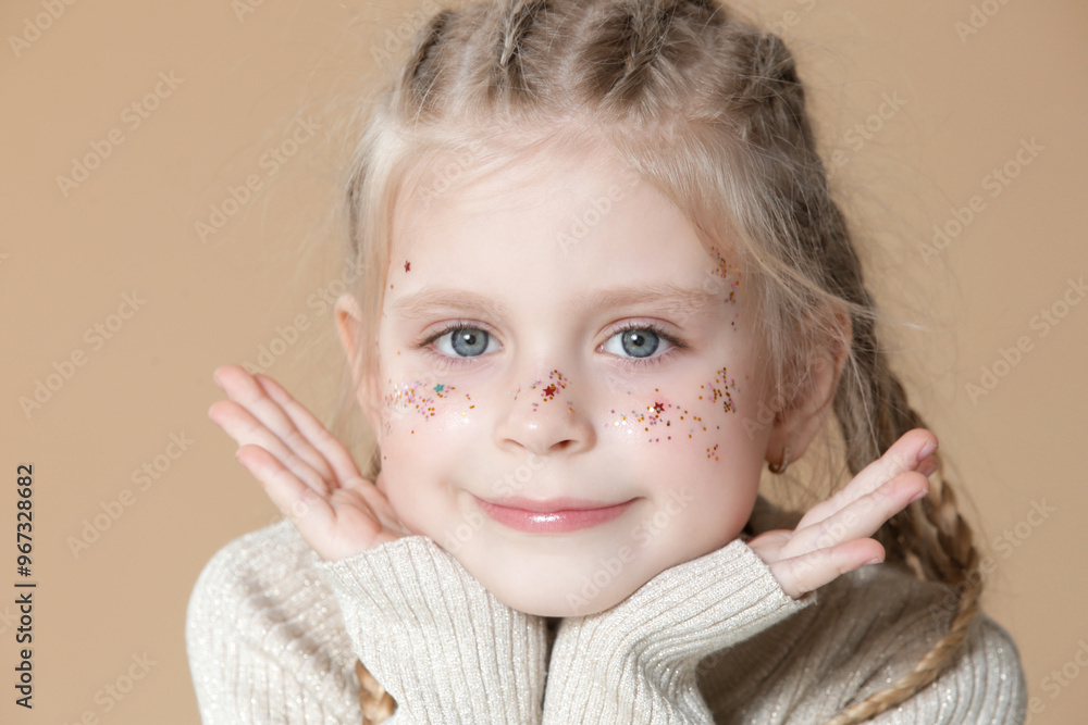 Portrait of cute little blonde girl with boxer braids and glitters on face Portrait of cute little blonde girl with boxer braids and glitters on face