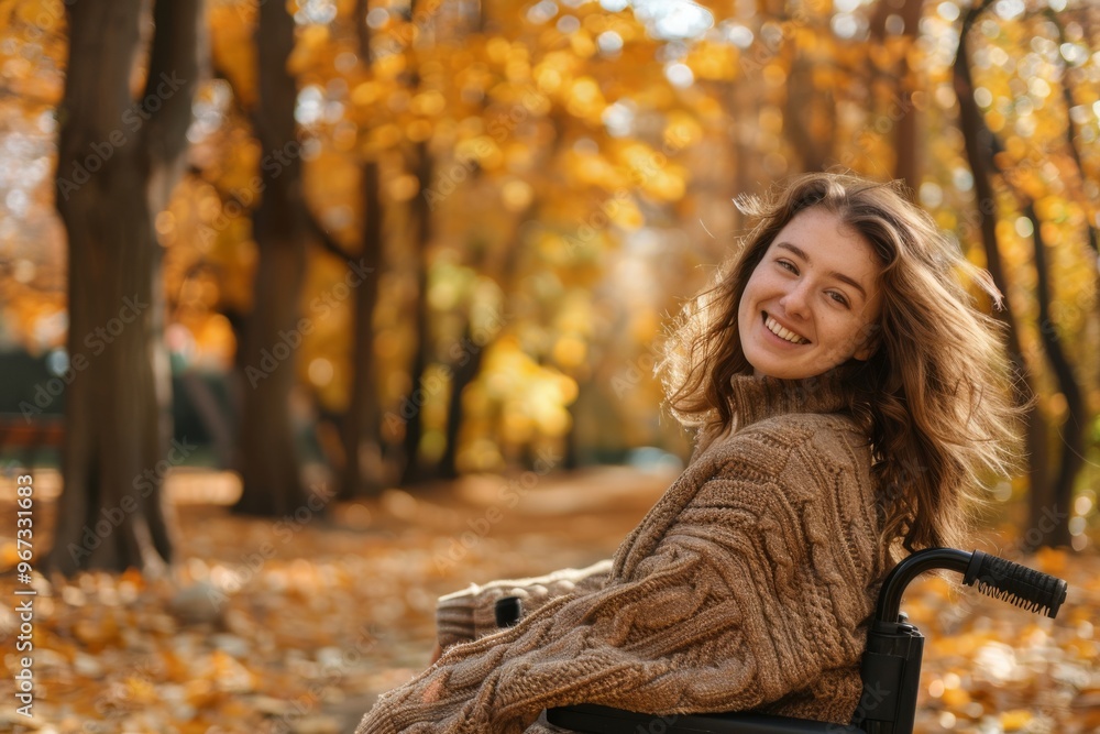 Joyful woman in a wheelchair amidst an autumn forest path, bathed in golden light and vibrant fall foliage, exuding warmth and inspiration. Joyful woman in a wheelchair amidst an autumn forest path, bathed in golden light and vibrant fall foliage, exuding warmth and inspiration.