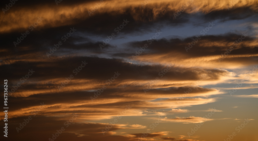 Sky with colorful and vivid sunset clouds. Natural background. Sky with colorful and vivid sunset clouds. Natural background.