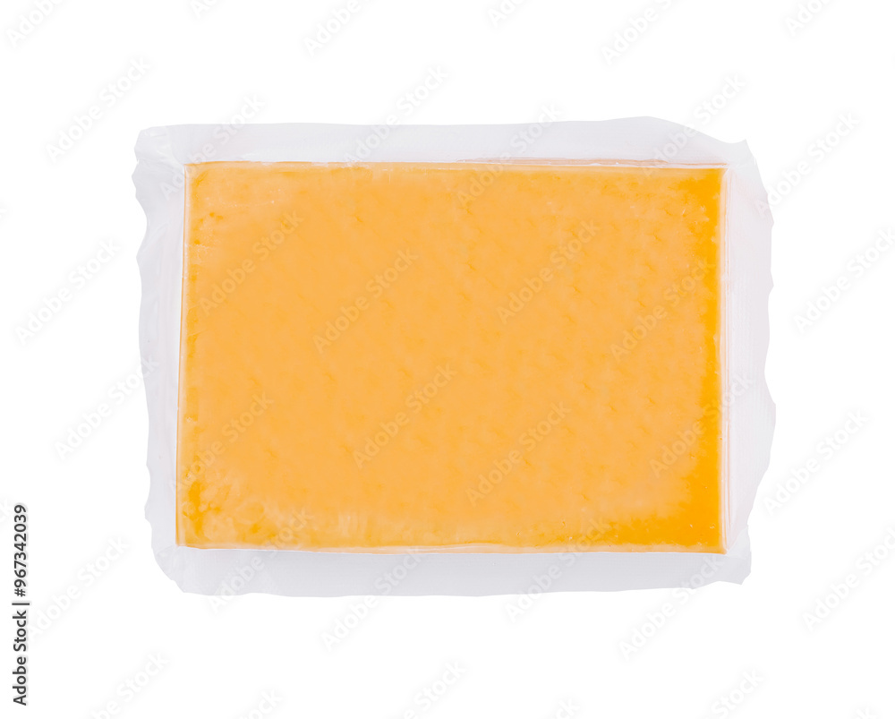 Vacuum packed block of cheddar cheese isolated on white background Vacuum packed block of cheddar cheese isolated on white background