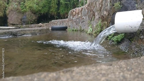 Water flows from a medium sized pipe