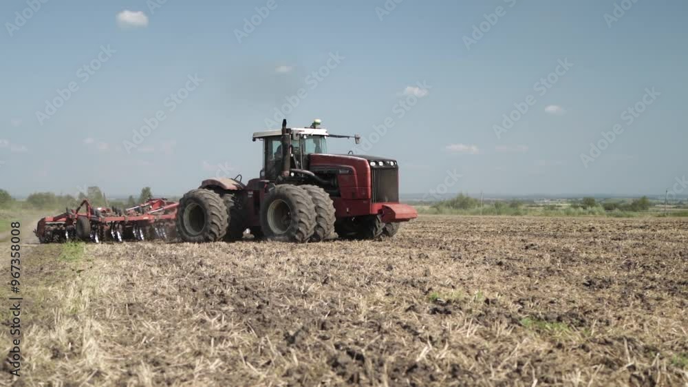 Tractor Working on Farmland and Cultivating the Field Tractor Working on Farmland and Cultivating the Field