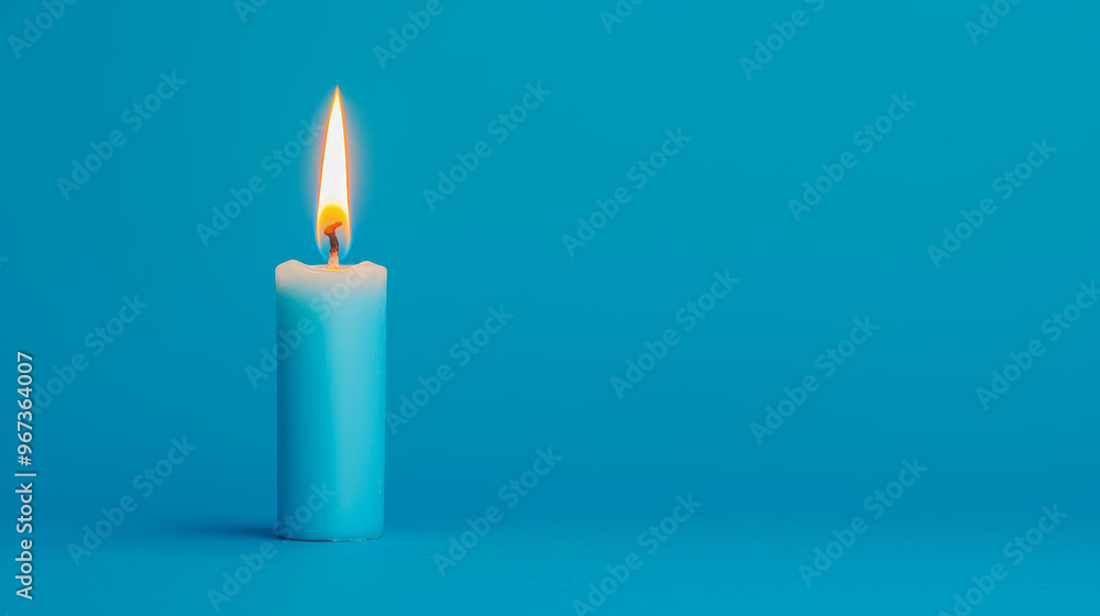 Blue candle burning with a vibrant flame on a blue background, symbolizing warmth, tranquility, and relaxation Blue candle burning with a vibrant flame on a blue background, symbolizing warmth, tranquility, and relaxation
