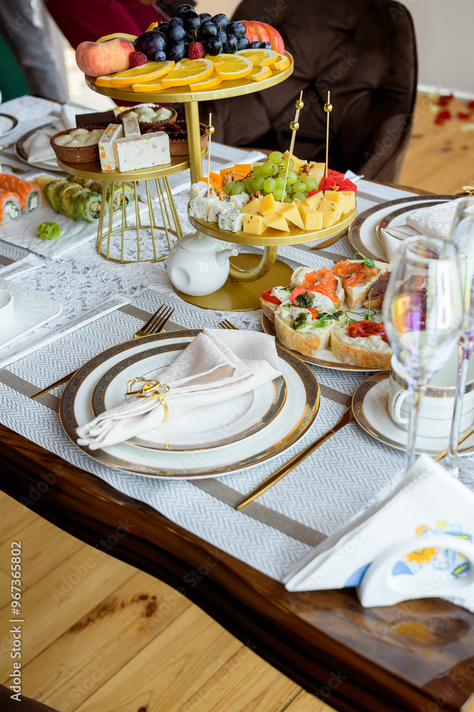 Fototapeta premium Arranged festive table. Table with snacks for a special occasion Romantic dinner