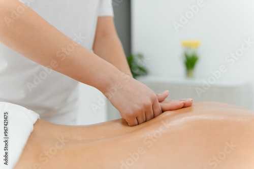 Young man is enjoying massage on spa treatment