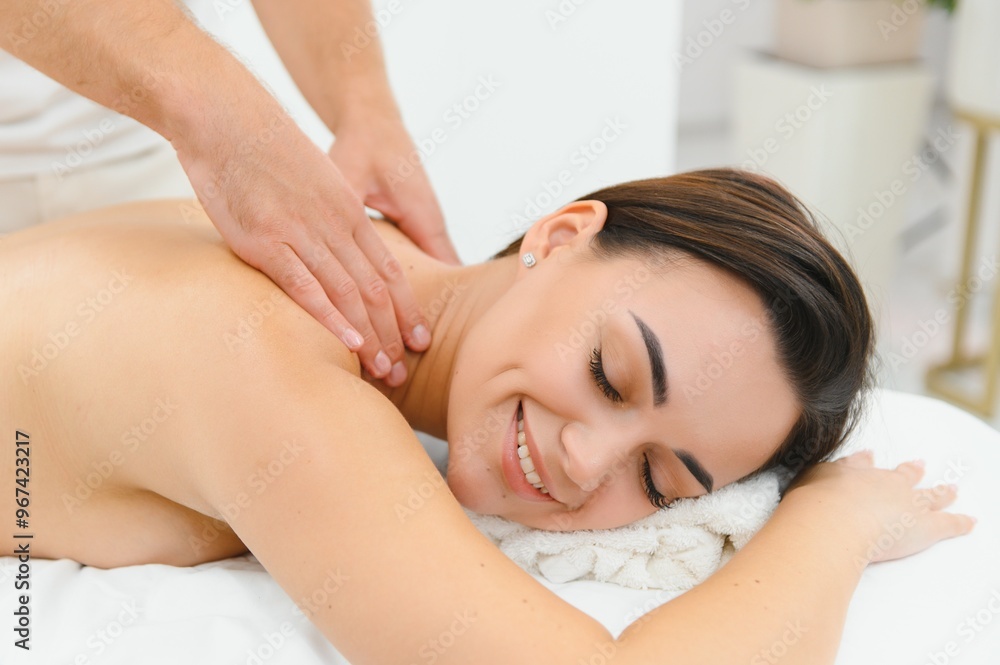 Spa therapy. Beautiful young woman lying on table during massage in salon, closeup Spa therapy. Beautiful young woman lying on table during massage in salon, closeup