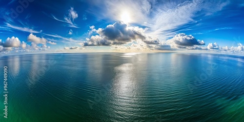 Aerial view of a completely flat and unmoving ocean meeting a horizon without any curvature or distortion. photo