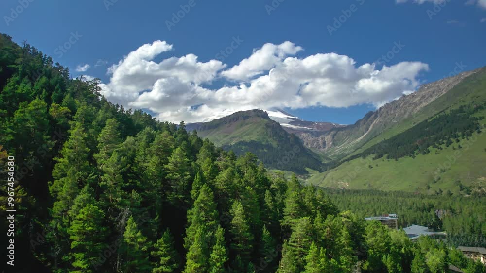 Aerial panorama of the snowy peaks of Mount Elbrus in the clouds Aerial panorama of the snowy peaks of Mount Elbrus in the clouds