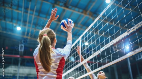 women volleyball players hit the ball using a spiked net