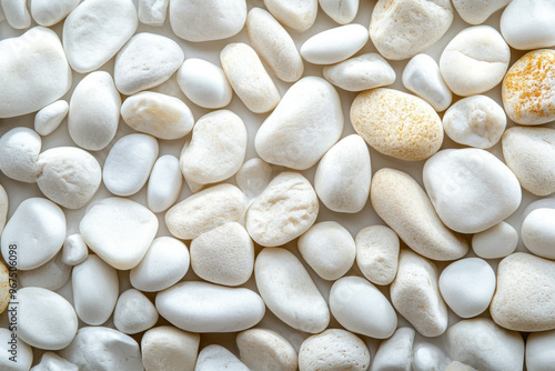 Background of white smooth pebble stones, close up