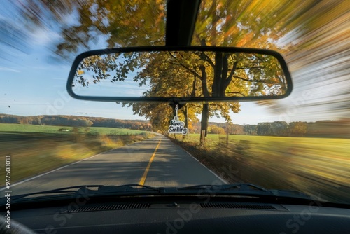 Driving down a scenic country road in autumn, view from inside the car. photo