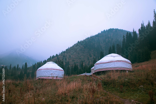 Kazakh national yurt with national ornament. Autumn mountains on the background. Kazakhstan, Almaty, Medeo photo