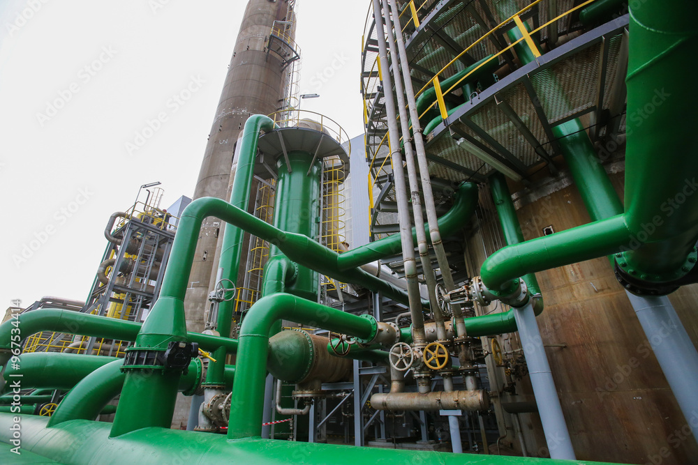 Pipelines, equipment, and chimneys of the chemical industry in the factory area Pipelines, equipment, and chimneys of the chemical industry in the factory area