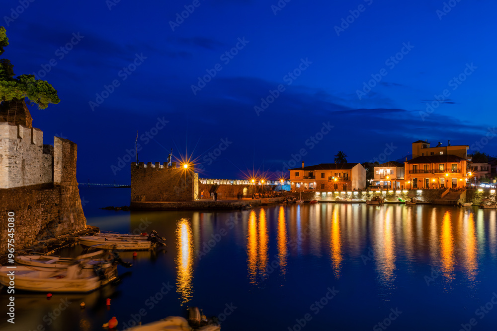 Lights reflecting water at the port of Nafpaktos in Greece.