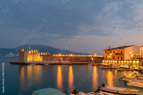 Obraz na płótnie Nafpaktos port in Greece against the city lights.
w salonie