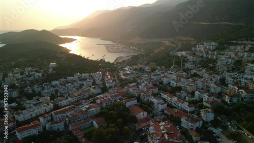 Aerial view of a serene harbor with boats and Castellorizo Island at sunset, Kas, Turkey. photo