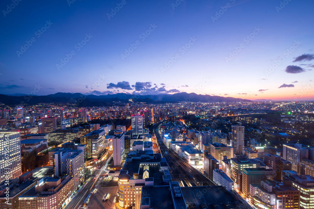 Fototapeta premium sunset or sun rise of Sapporo cityscape with Skyline and office building and downtown of sappiro is populars ciy from toursim Hokkaido, Japan with twilight sky in spring season