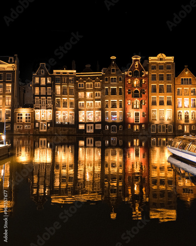 Photography Night city street facade reflection in Amsterdamer canal water